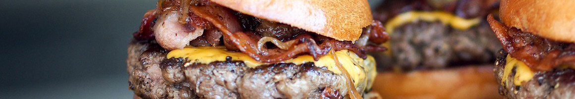 Eating Burger at PS Burgers restaurant in Mineola, NY.